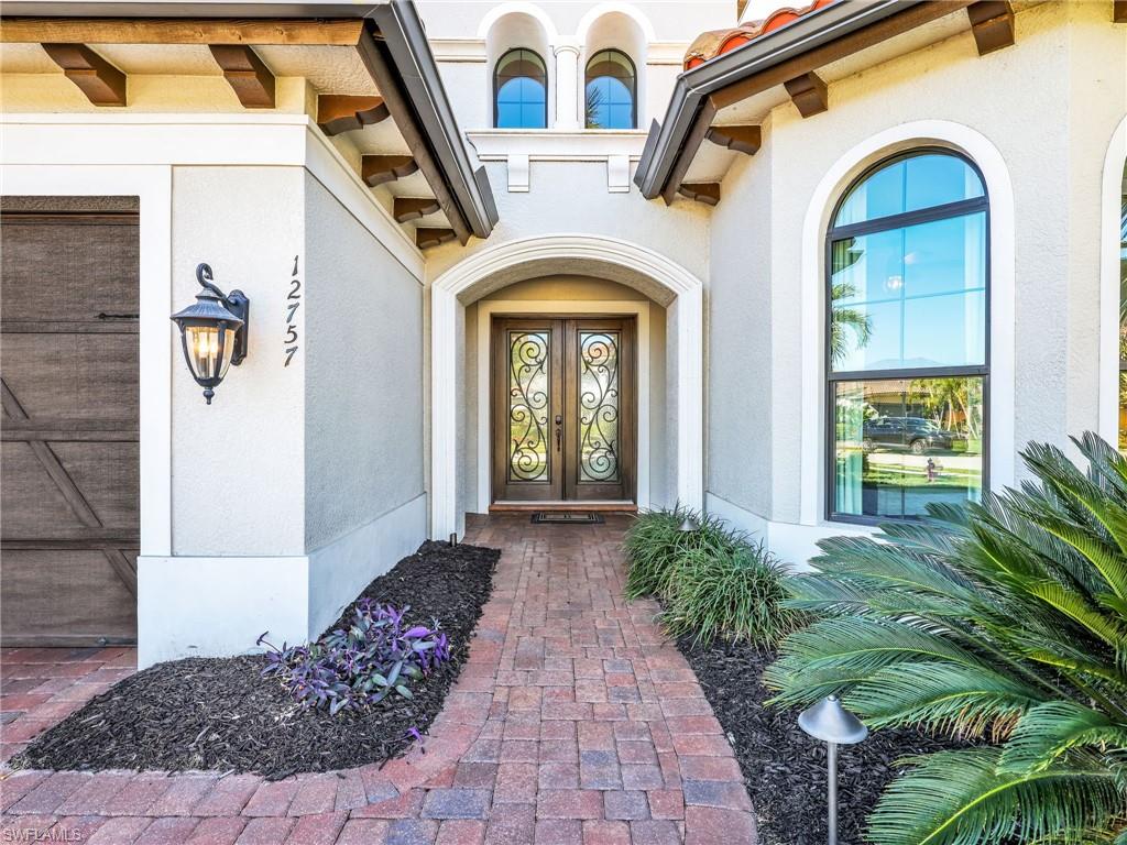 12757 Dundee Lane Naples, FL 34120 - Photo 5 of 48 a front view of a house