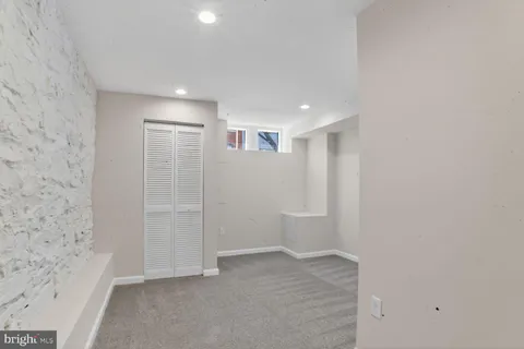 a bathroom with a toilet sink and shower