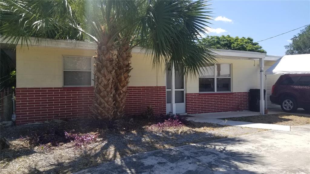 11134 Grant Drive Port Richey, FL 34668 - Photo 1 of 1 a view of a house with a yard