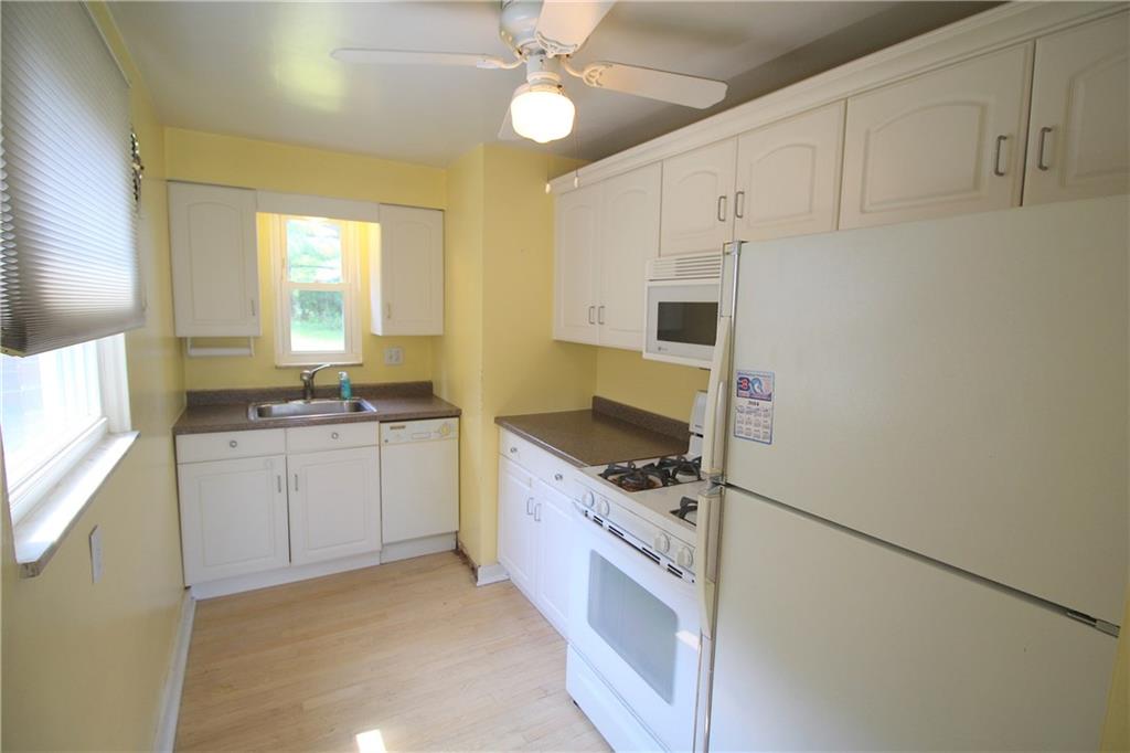 Updated kitchen with white cabinetry.