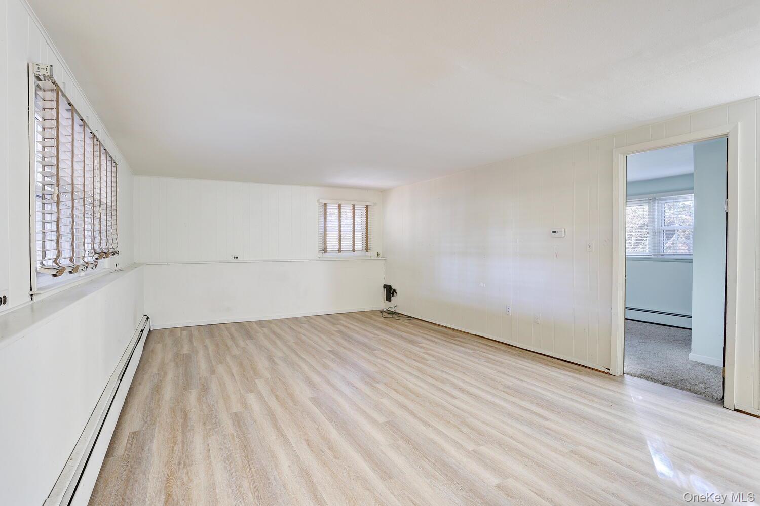 12 Van Gogh Lane Airmont, NY 10901 - Photo 13 of 21 wooden floor in an empty room with a window
