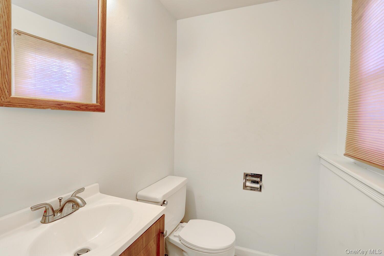 12 Van Gogh Lane Airmont, NY 10901 - Photo 15 of 21 a white toilet sitting next to a white sink
