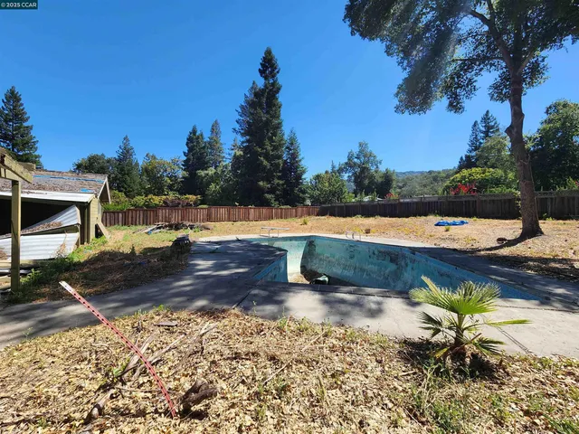 a view of a lake with a yard