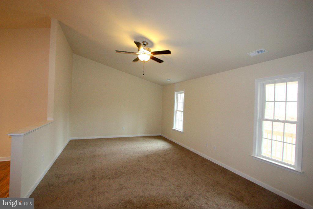 7 Winding Ridge Way Bumpass, VA 23024 - Photo 6 of 21 a view of room with a ceiling fan and window