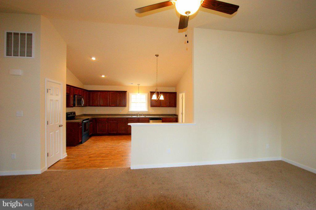 7 Winding Ridge Way Bumpass, VA 23024 - Photo 7 of 21 a view of a living room with kitchen countertops and a ceiling fan
