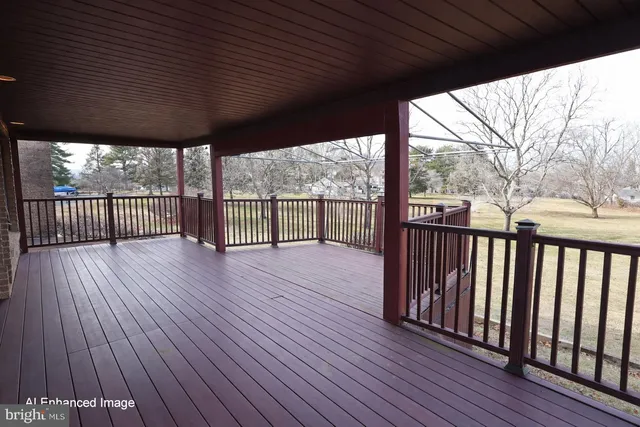 a view of a porch with wooden floor