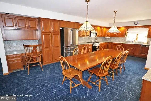 a dining room with furniture window and wooden floor