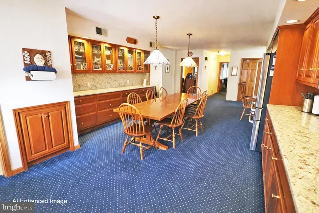 a dining room with furniture and window