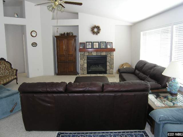 15510 Quicksilver Drive Reno, NV 89511 - Photo 3 of 3 a living room with furniture and a fireplace