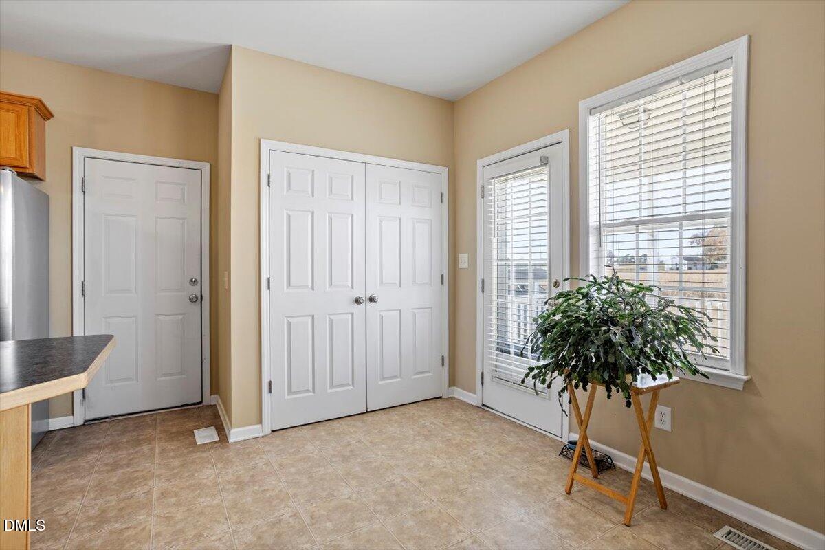 119 Victory Circle Willow Spring, NC 27592 - Photo 18 of 33 a view of a room with a potted plant and a window