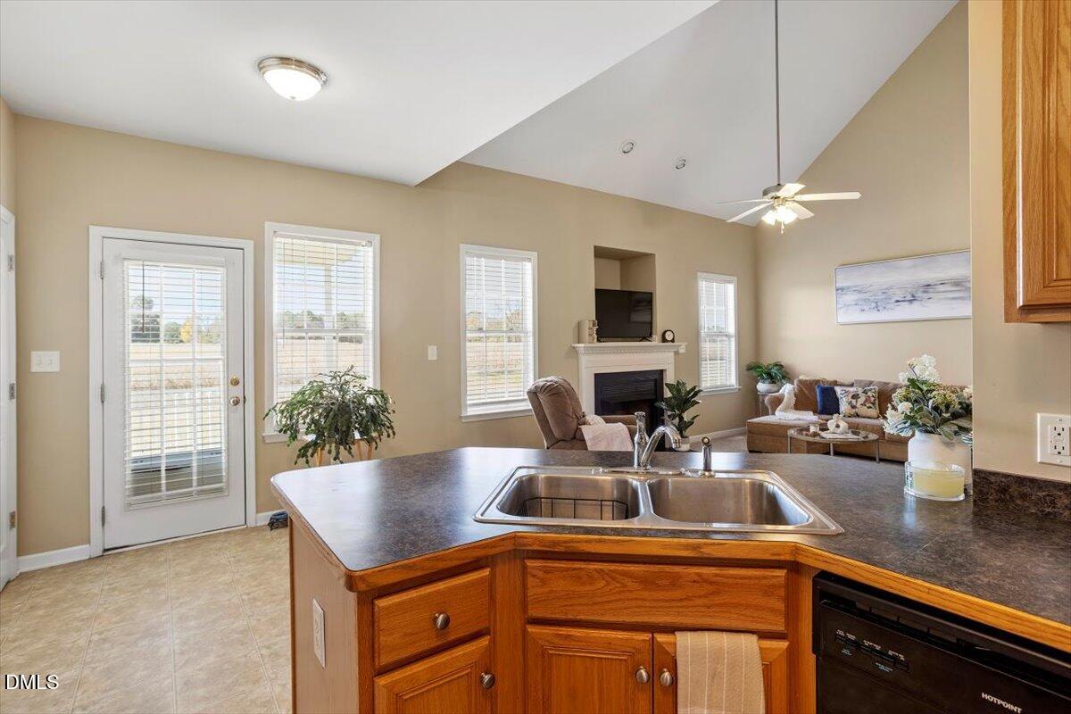 119 Victory Circle Willow Spring, NC 27592 - Photo 23 of 33 a kitchen with a sink a counter and cabinets