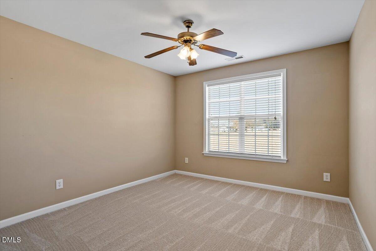 119 Victory Circle Willow Spring, NC 27592 - Photo 27 of 33 a view of an empty room with a window