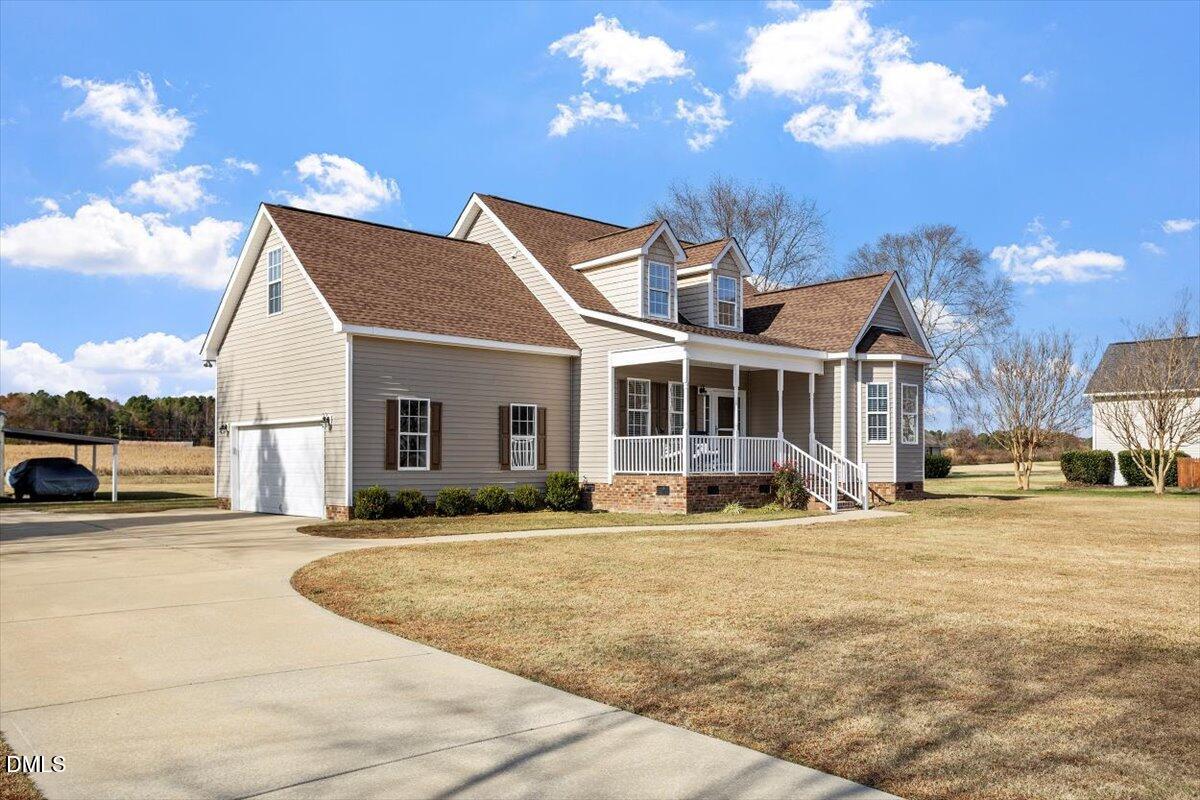 119 Victory Circle Willow Spring, NC 27592 - Photo 2 of 33 a view of a house with a yard