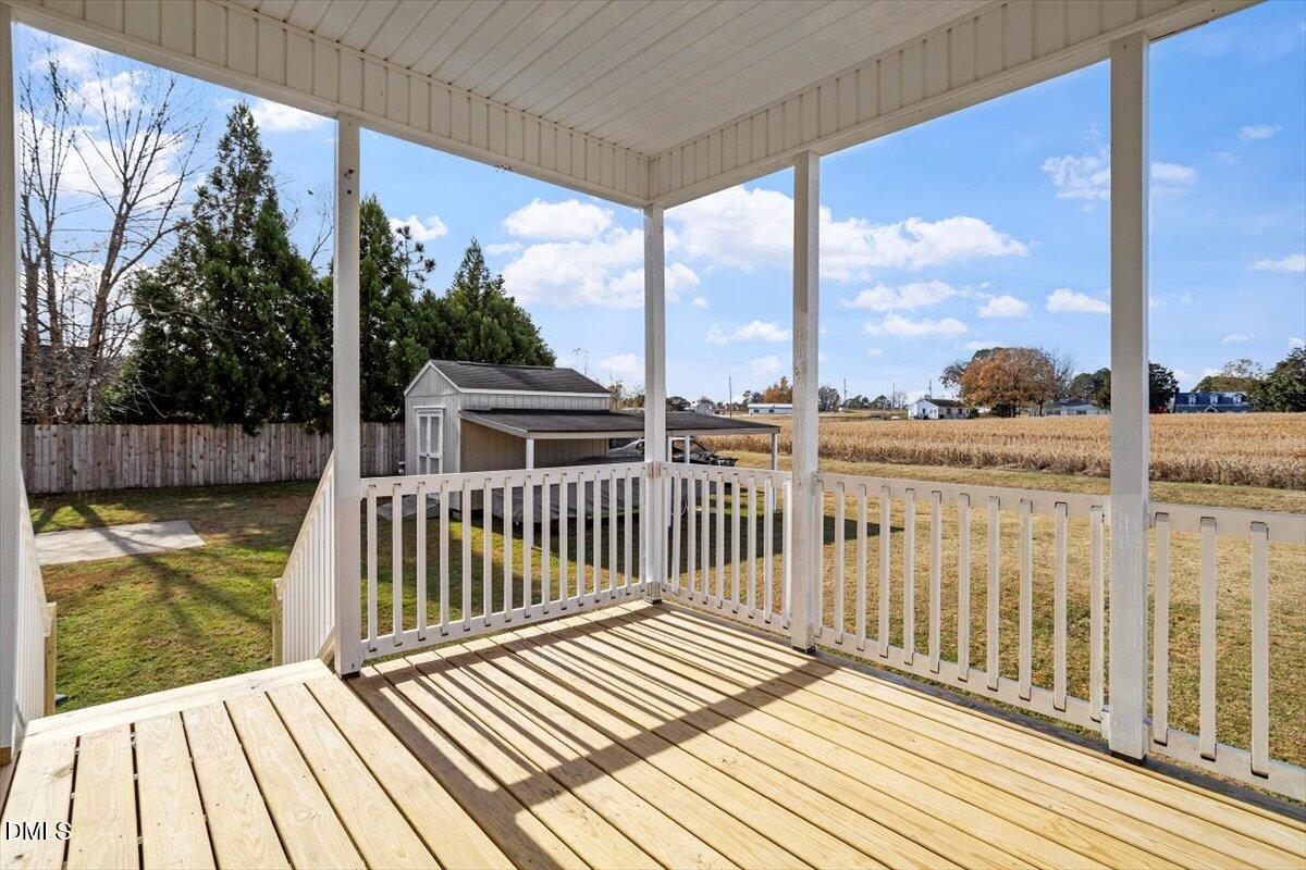 119 Victory Circle Willow Spring, NC 27592 - Photo 32 of 33 a view of a balcony with wooden floor
