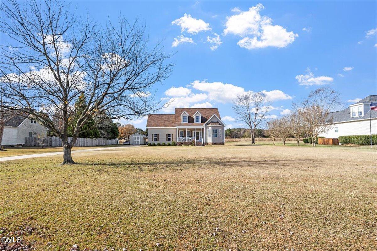 119 Victory Circle Willow Spring, NC 27592 - Photo 3 of 33 a view of a house with a yard covered with snow