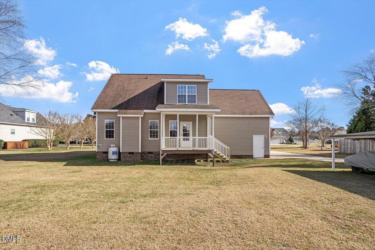 119 Victory Circle Willow Spring, NC 27592 - Photo 4 of 33 a front view of a house with a yard