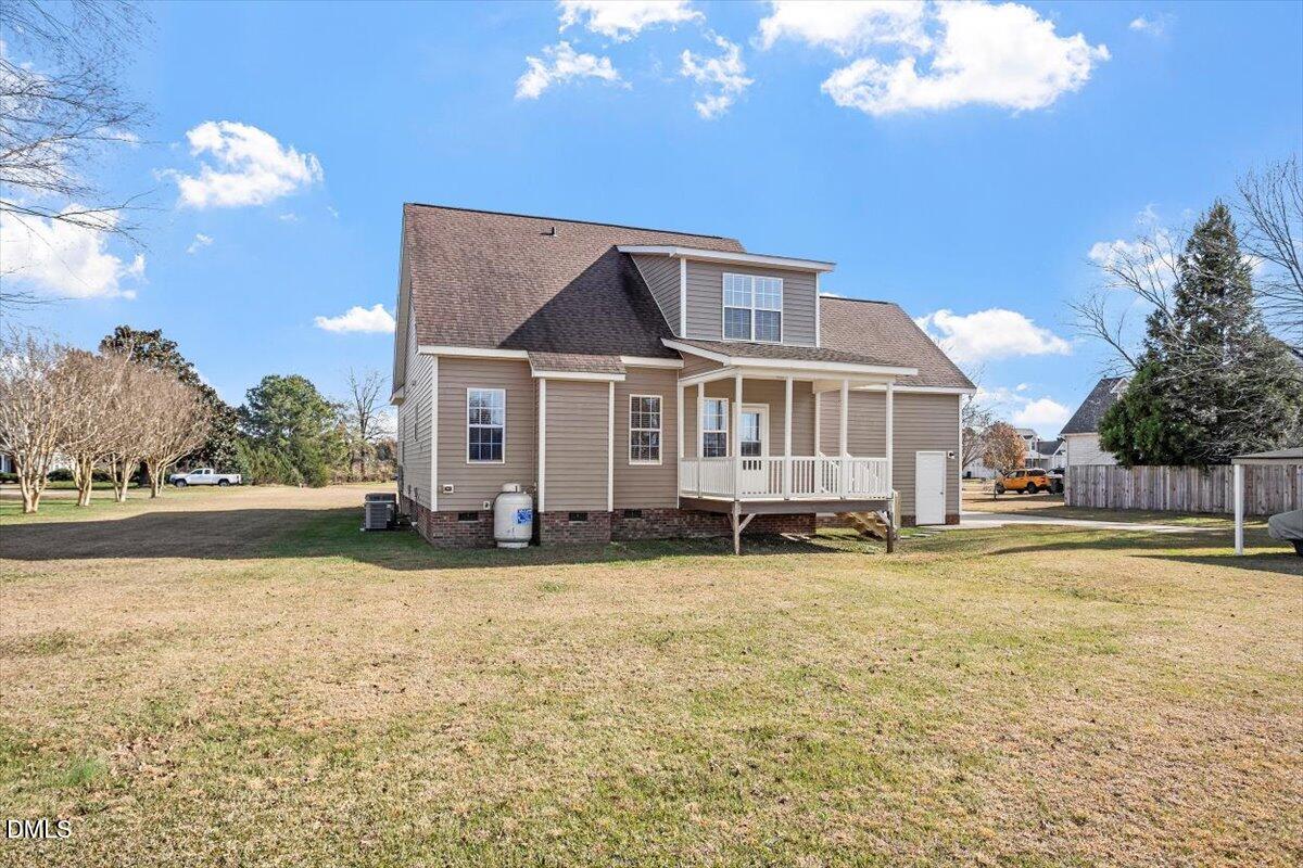 119 Victory Circle Willow Spring, NC 27592 - Photo 5 of 33 a view of a house with swimming pool next to a yard