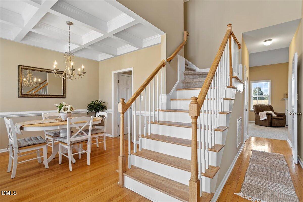 119 Victory Circle Willow Spring, NC 27592 - Photo 7 of 33 a view of a dining room with furniture and wooden floor