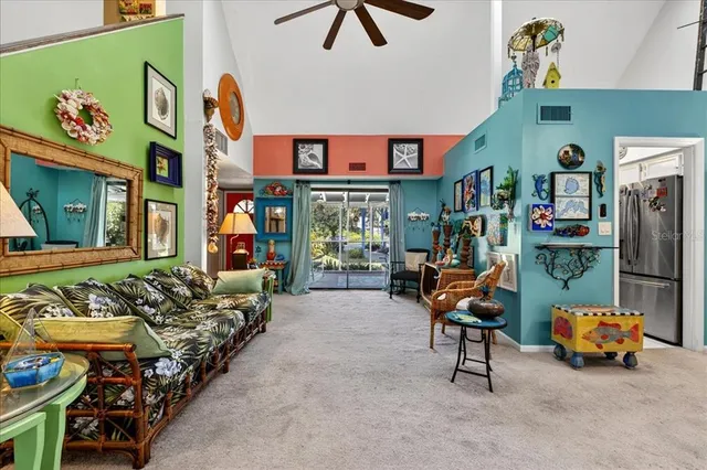 a living room with furniture a rug and a flat screen tv