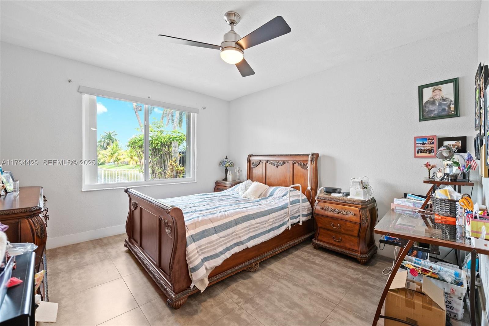 7045 Southwest 161st Place Miami, FL 33193 - Photo 18 of 33 a bed room with a bed and a window