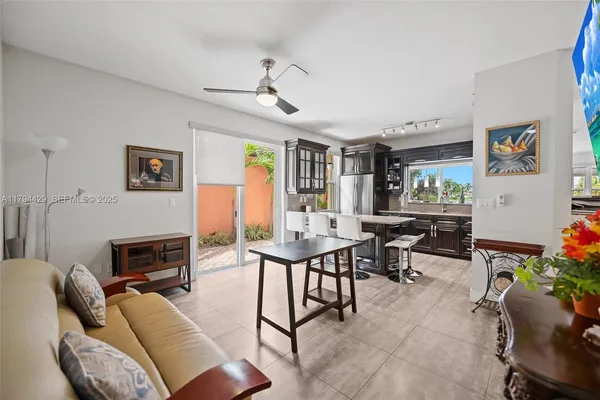 a living room with furniture flat screen tv and a fireplace