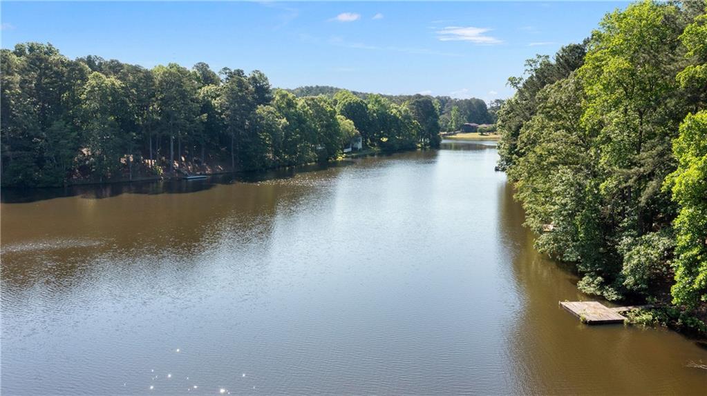 24 Commerce Row Northeast Cartersville, GA 30121 - Photo 3 of 37 a view of a lake with trees