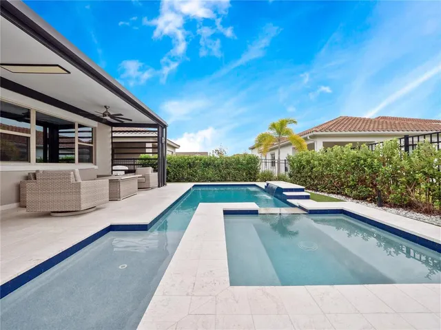 a view of swimming pool with a lounge chair