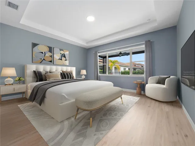 a bedroom with a bed and a couch