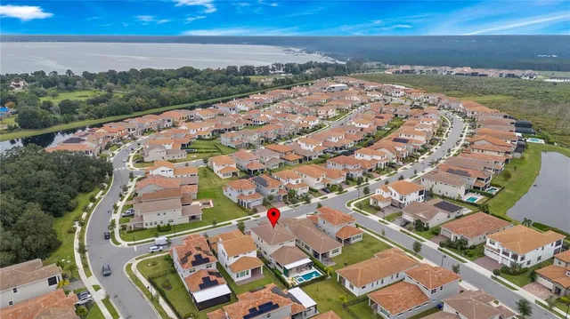 an aerial view of residential houses with outdoor space