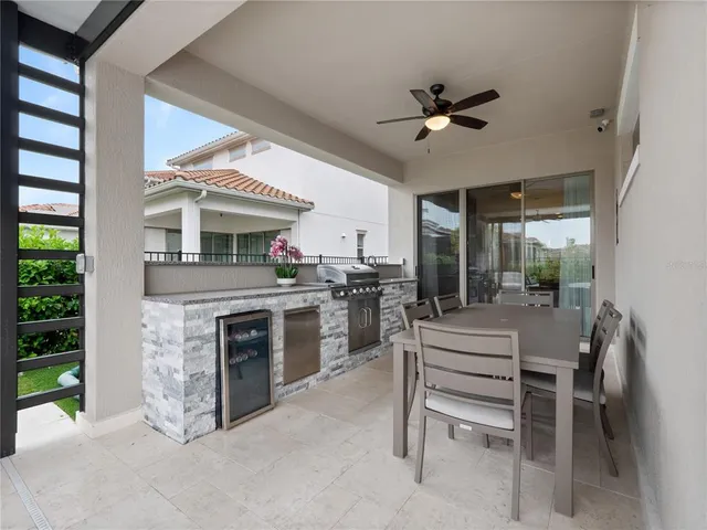 a kitchen with a stove a sink and a refrigerator