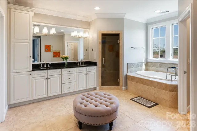 a spacious bathroom with a sink and a mirror