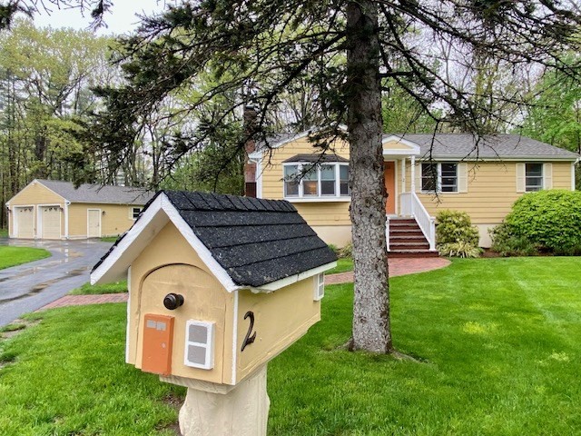 a view of a house with a yard