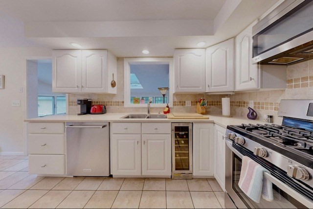 2 Russett Road Bedford, MA 01730 - Photo 11 of 41 a kitchen with granite countertop white cabinets and white appliances