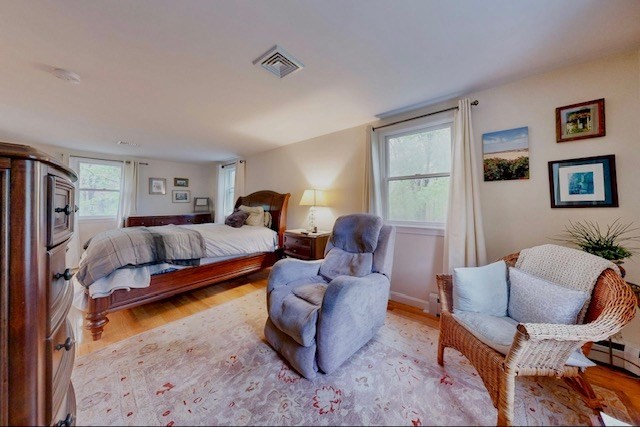 2 Russett Road Bedford, MA 01730 - Photo 17 of 41 a bedroom with a bed and wooden floor