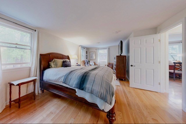 2 Russett Road Bedford, MA 01730 - Photo 19 of 41 a bedroom with a bed and a dresser