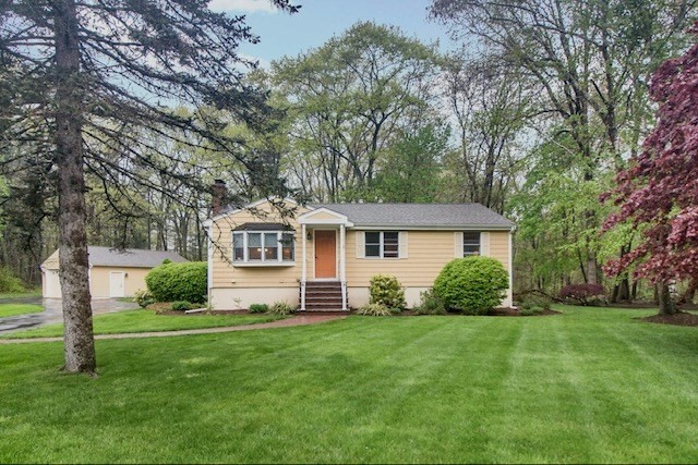 2 Russett Road Bedford, MA 01730 - Photo 2 of 41 a front view of a house with a garden