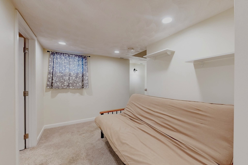 2 Russett Road Bedford, MA 01730 - Photo 32 of 41 a bedroom with a bed and a painting on the wall