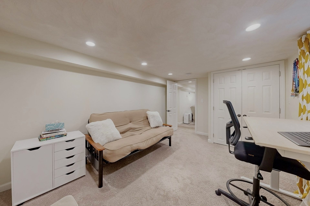 2 Russett Road Bedford, MA 01730 - Photo 35 of 41 a living room with furniture a rug and gym equipment