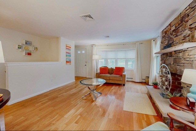 2 Russett Road Bedford, MA 01730 - Photo 4 of 41 a living room with furniture and a fireplace