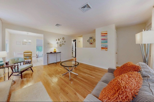 2 Russett Road Bedford, MA 01730 - Photo 5 of 41 a living room with furniture and a table