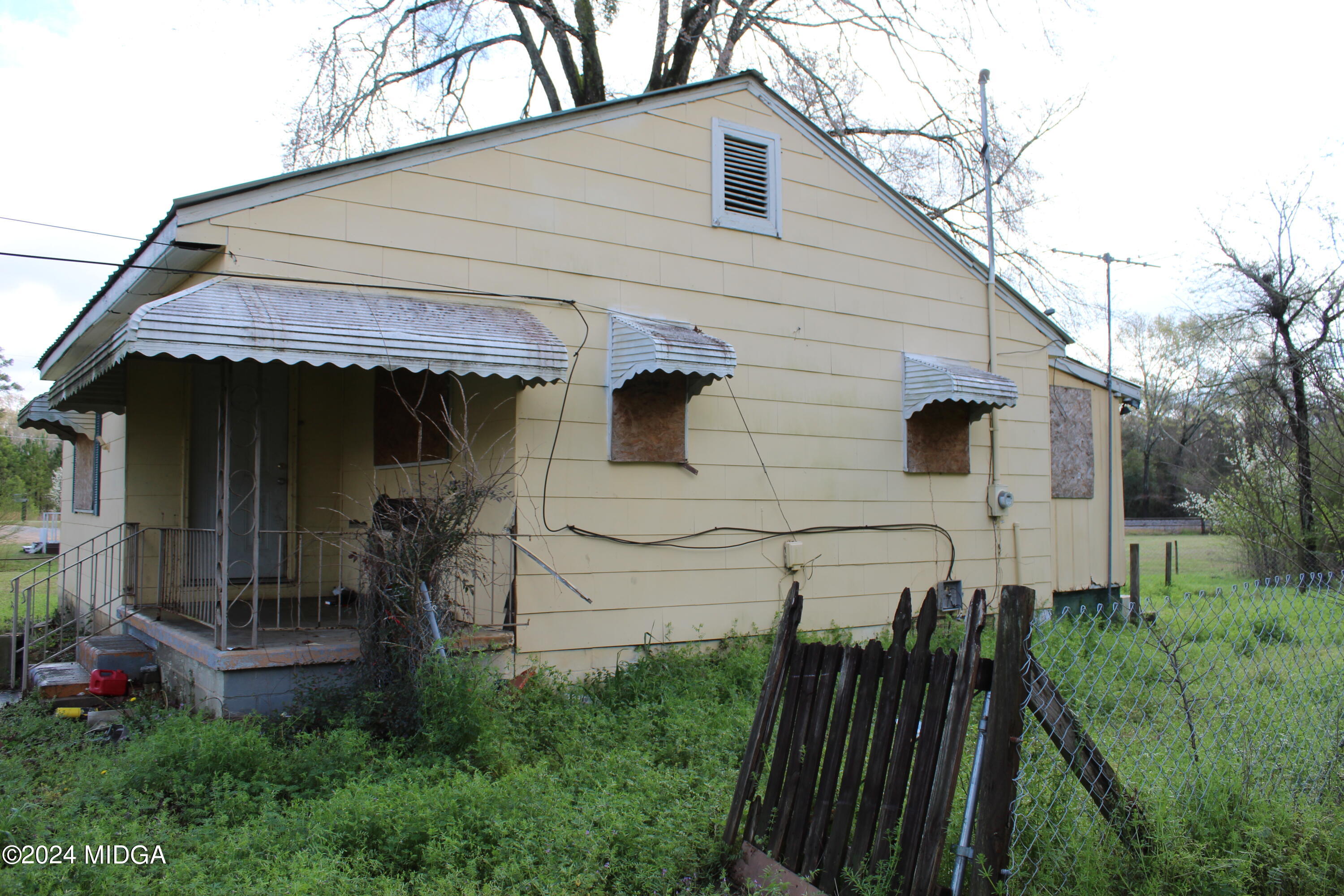 2346 Liberty Church Road Macon, GA 31216 - Photo 11 of 16 a front view of a house with a yard