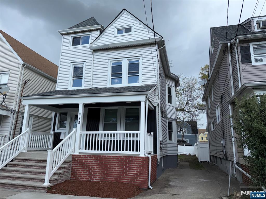 178 Berry Street Hackensack, NJ 07601 - Photo 3 of 22 a view of a house with a deck