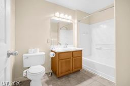 7701 West Robindale Road, Unit 277 Las Vegas, NV 89113 - Photo 22 of 33 A pristine bathroom features a single vanity and a shower-tub combination.