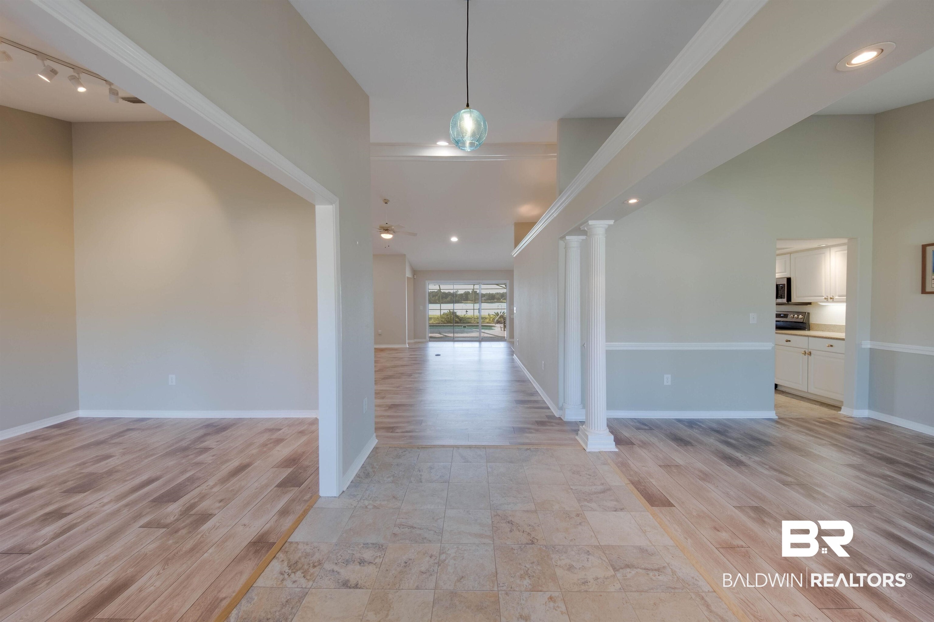 9462 Lakeview Drive Foley, AL 36535 - Photo 2 of 50 Foyer featuring ornate columns, a towering ceiling, and light wood-type flooring