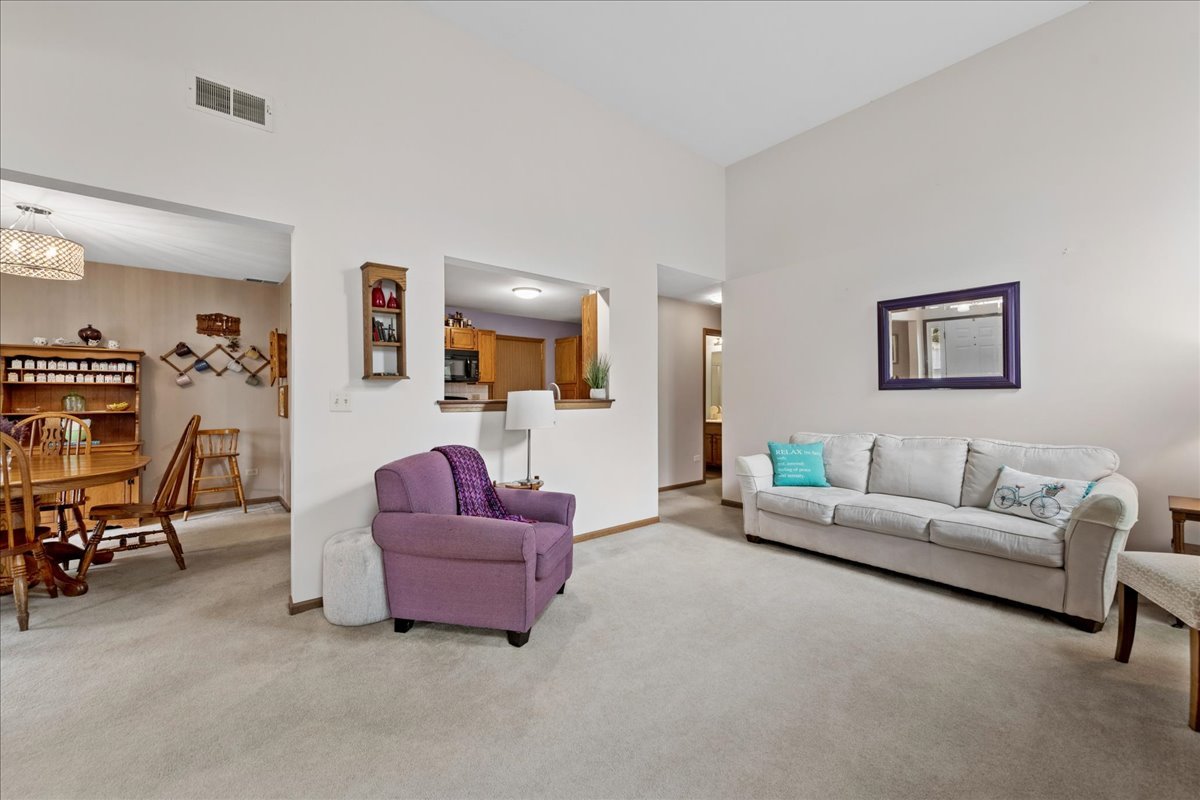 2110 Peach Tree Lane, Unit 2110 Algonquin, IL 60102 - Photo 7 of 21 a living room with furniture and a couch