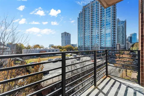 a view of balcony with wooden floor