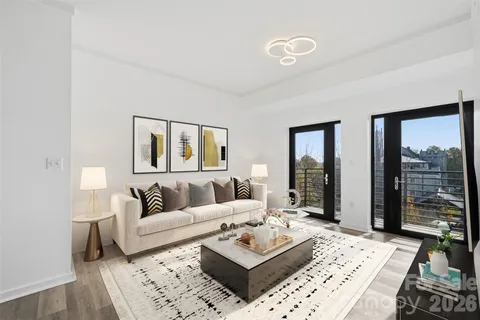 a living room with furniture and a rug