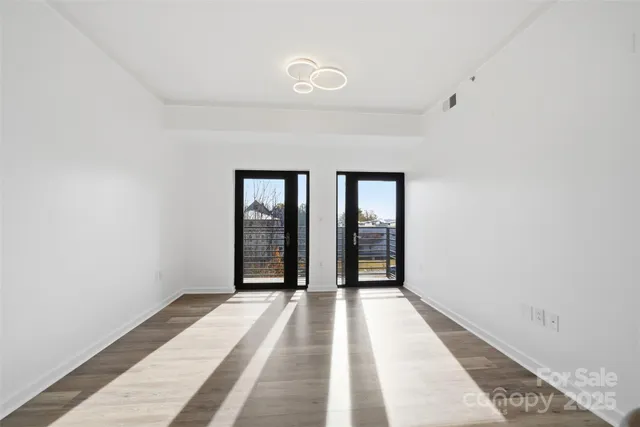 a view of a room with a large window