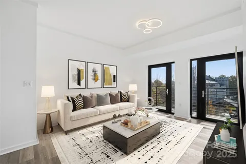 a living room with furniture and a rug