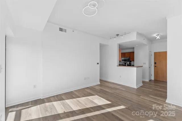 a view of kitchen with window and stainless steel appliances